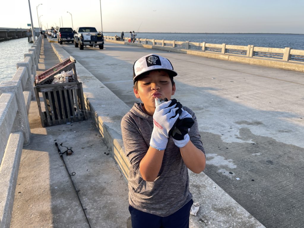 home image kid kissing a fish